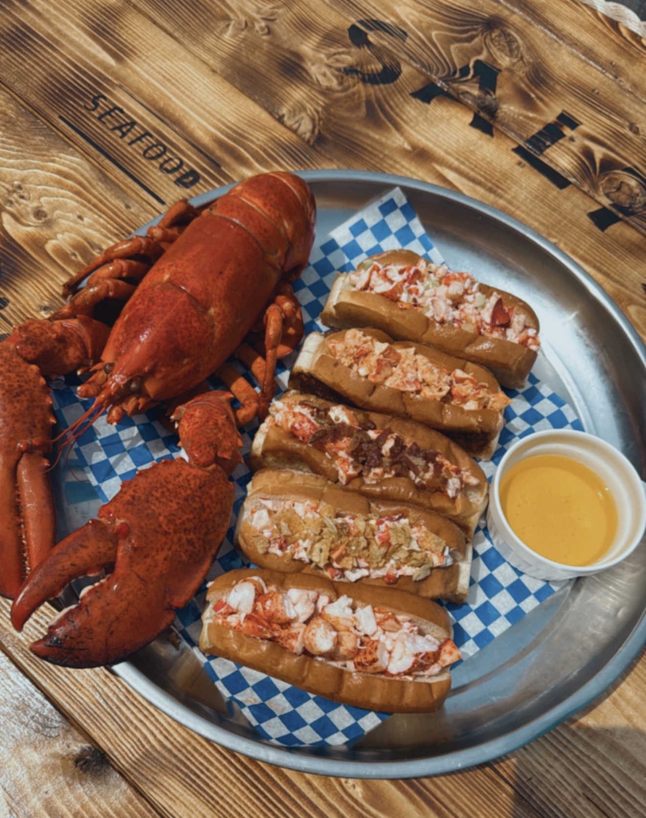 Fresh dockside seafood preparation on weathered maritime timber